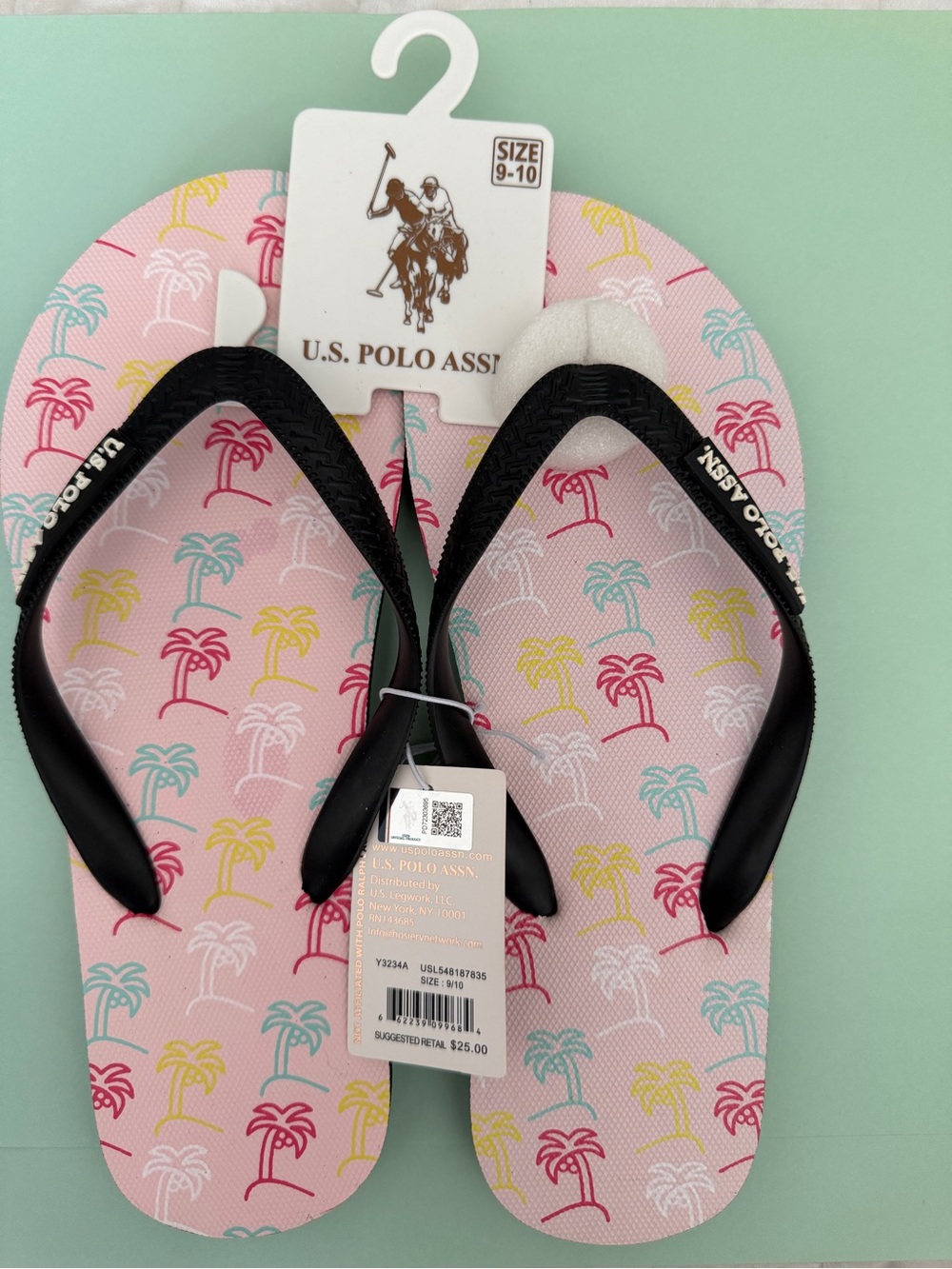 U.S. Polo Assn. Kids Pink Flip Flops with Black Straps and Multicolor Palm Print